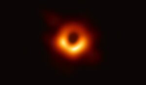 Black Holes Explained: Science Behind the Cosmic MysteryFirst-ever real image of a black hole captured by the Event Horizon Telescope showing glowing accretion disk around the event horizon